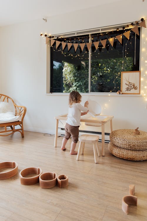 Free Photo Of Child Near Wooden Table Stock Photo