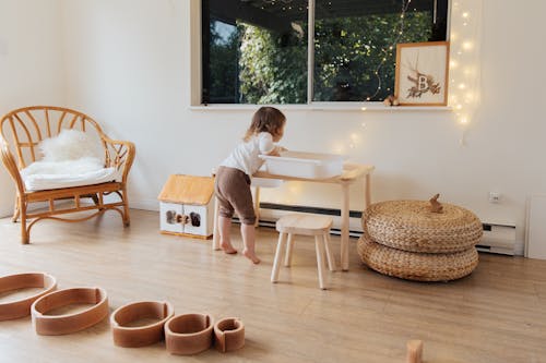 Free Photo Of Child Leaning On Wooden Table Stock Photo