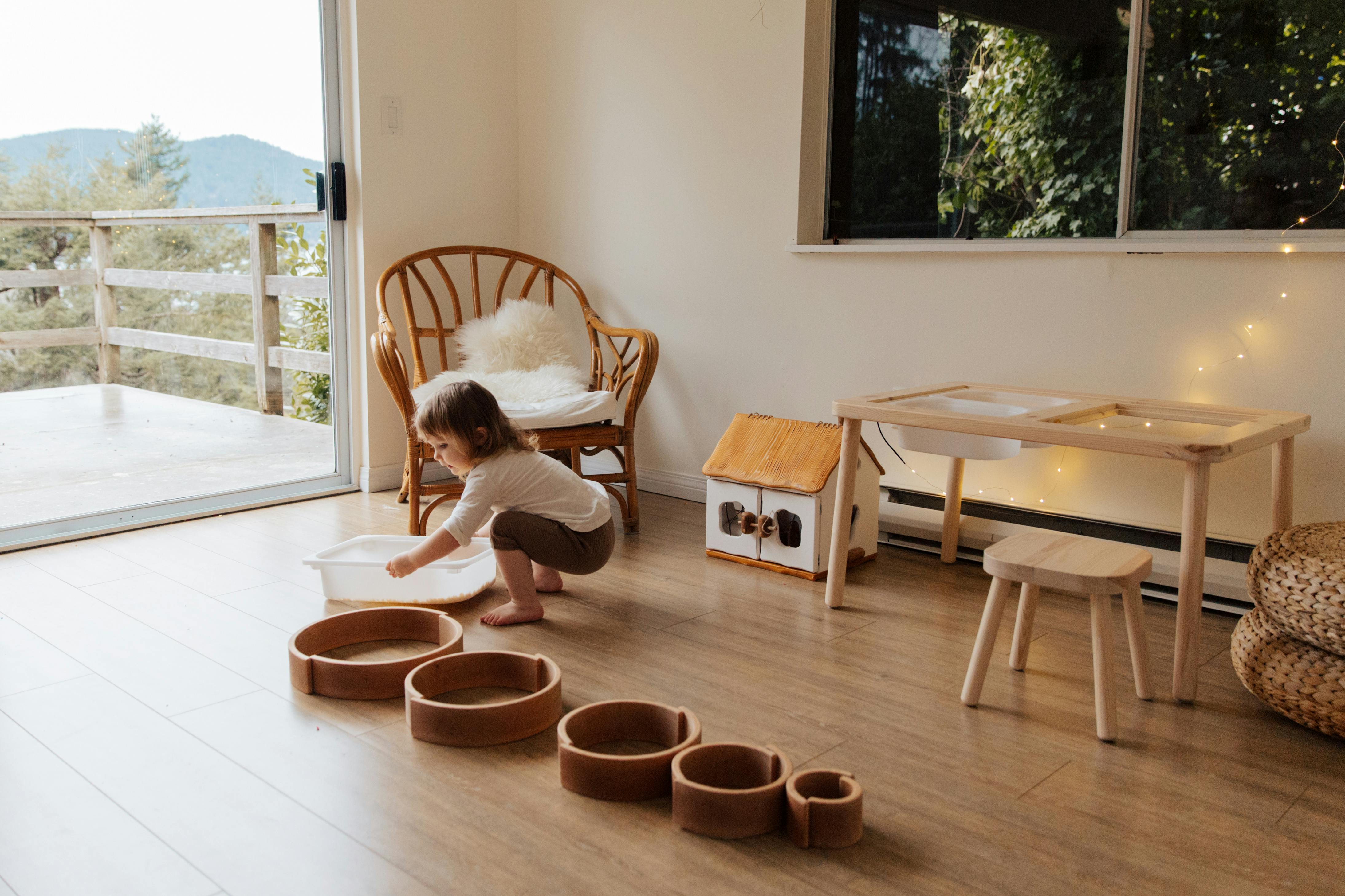 photo of child carrying tray