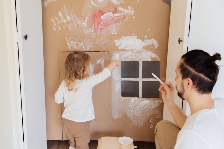 Photo Of Child Painting Cardboard