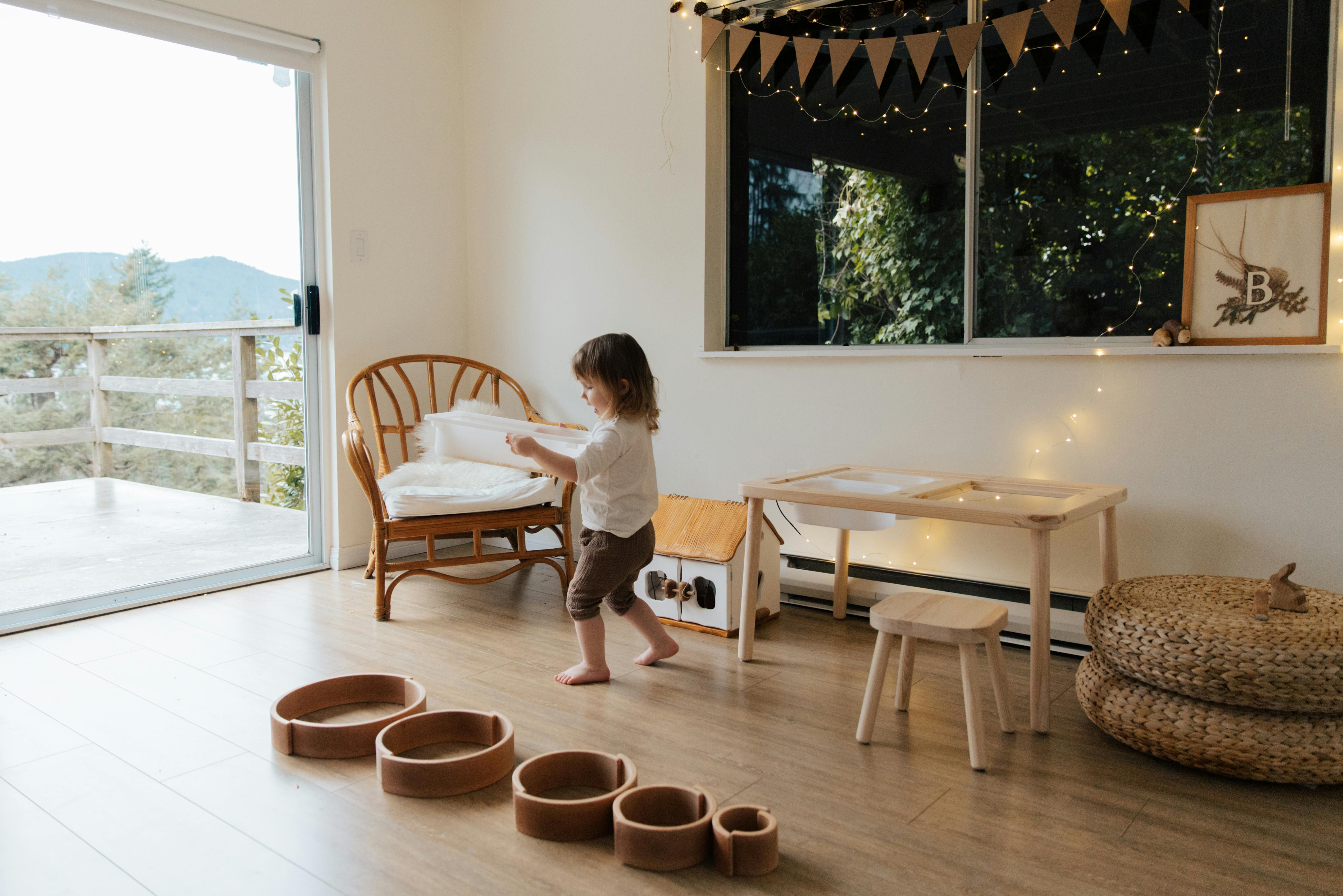 photo of child carrying tray