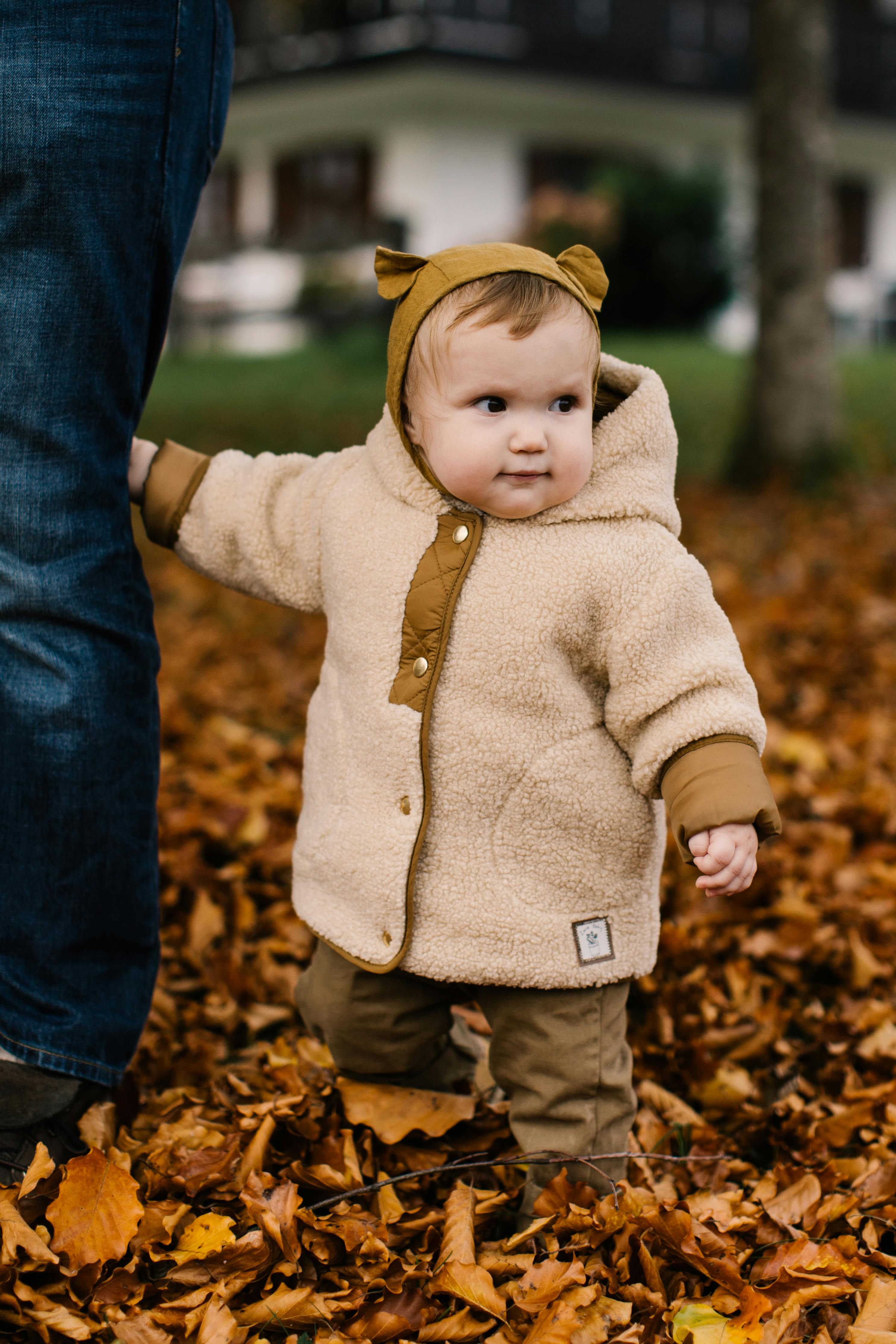 photo of baby wearing jacket