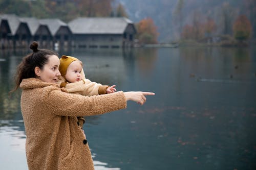 Free Photo Of Woman Carrying Baby Stock Photo