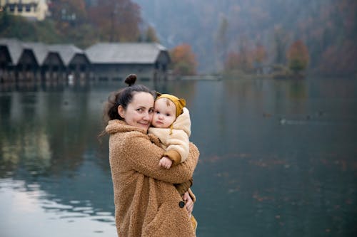 Free Photo Of Woman Hugging Baby Stock Photo