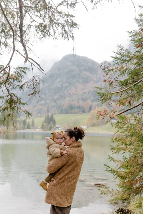 Free Photo Of Man Carrying Child Stock Photo