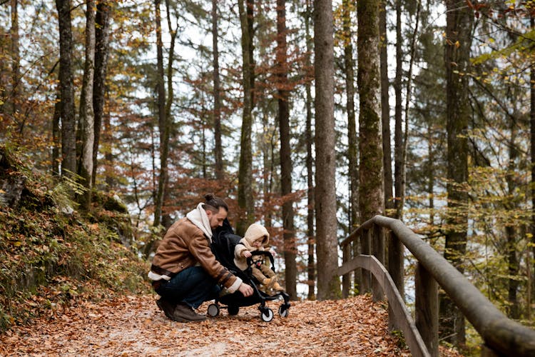 Photo Of Man Holding Stroller