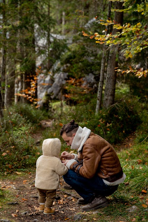 Photo Of Man Holding Baby