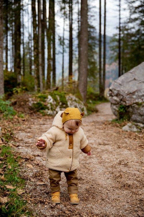 Free Photo Of Baby Standing On Dirt Road  Stock Photo