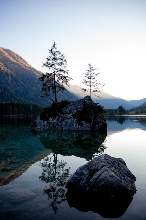 Photo Of Rocks In The Middle Of Lake