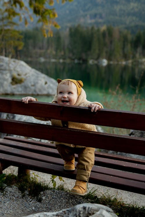 Photo Of Baby On Wooden Bench
