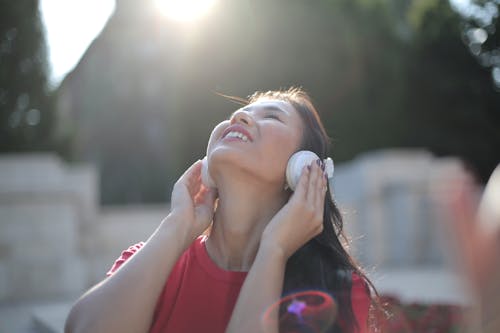 Photo Of Woman Holding Headphones