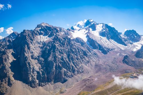 Free A breathtaking view of the Tian Shan mountains in Almaty, showcasing rugged peaks and snow-capped summits. Stock Photo