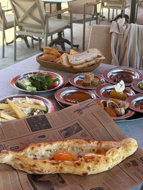 Free Delicious Turkish breakfast spread with varied dishes, served outdoors. Perfect for food lovers. Stock Photo