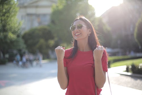 Woman in Red Top Wearing Sunglasses