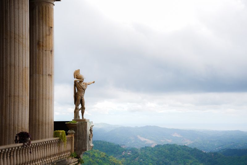 Bronze statue on the terrace of Temple of Leah overlooking Cebu's mountains