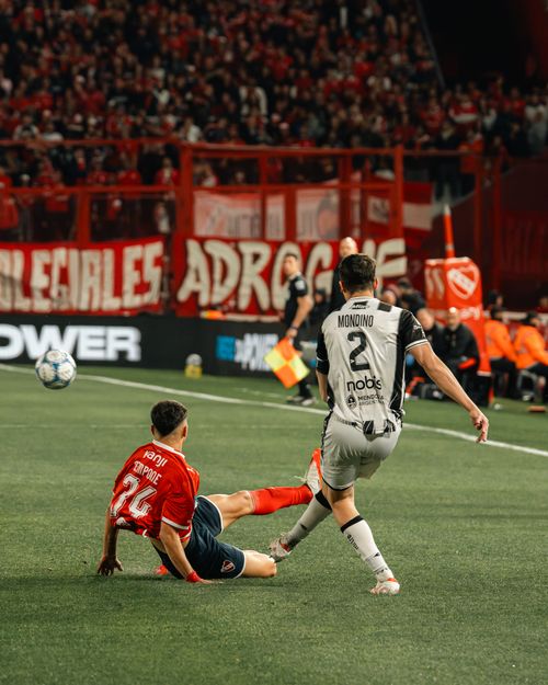 Free Dramatic moment in a soccer match with players in action under stadium lights. Stock Photo