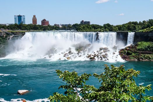Capturing the stunning beauty of Niagara Falls with a vibrant cityscape backdrop.