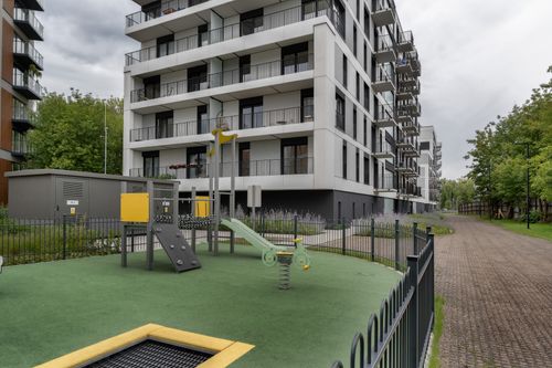 Free Urban apartment building with a small playground area. Stock Photo