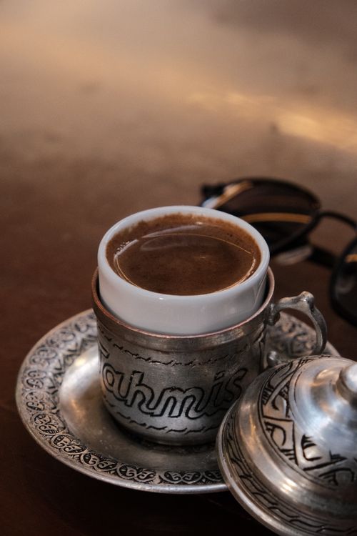 Free Close-up of traditional Turkish coffee in an intricately designed metal cup. Stock Photo