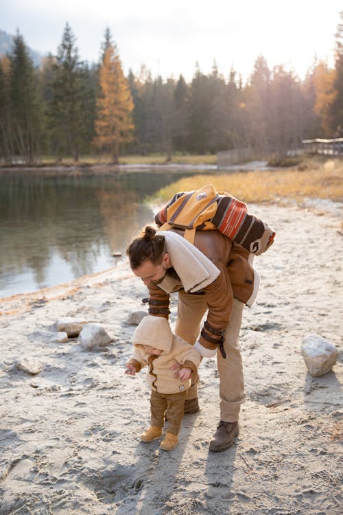 Free Photo Of Man Holding Baby Stock Photo