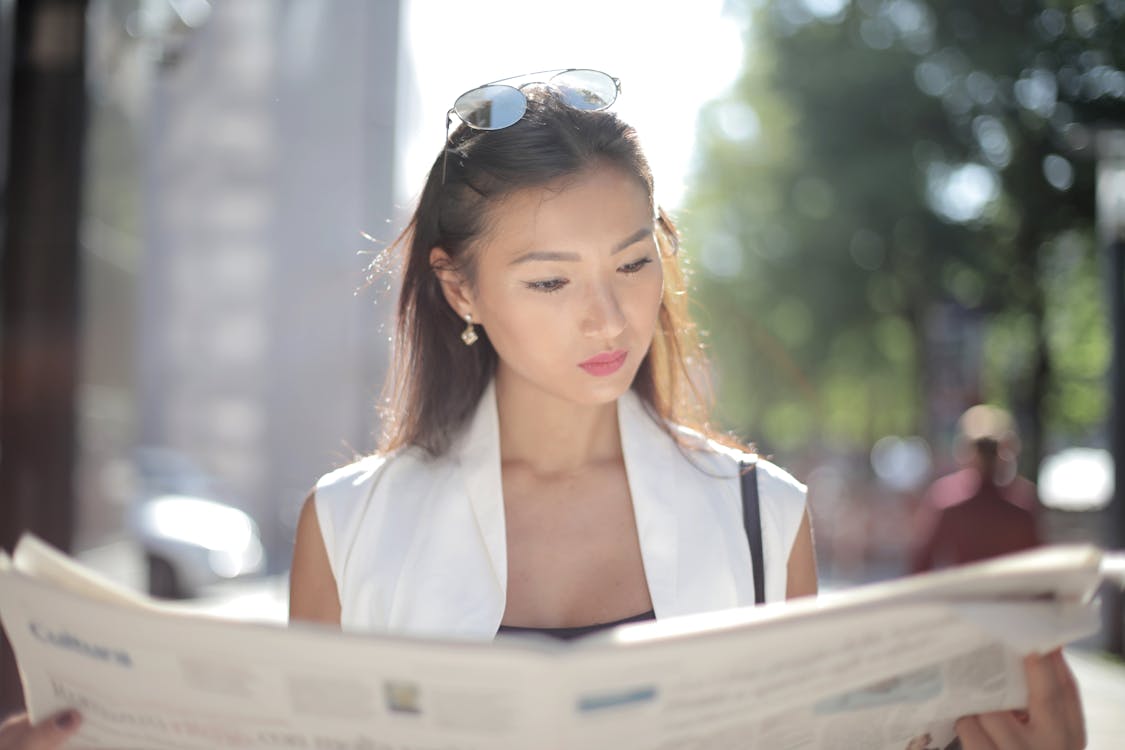 A woman reading about caregiver applications