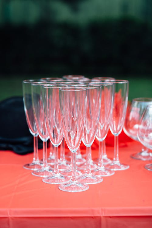 Clear Drinking Glasses on Red Table