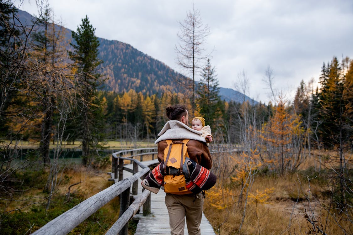 A man carrying a baby 