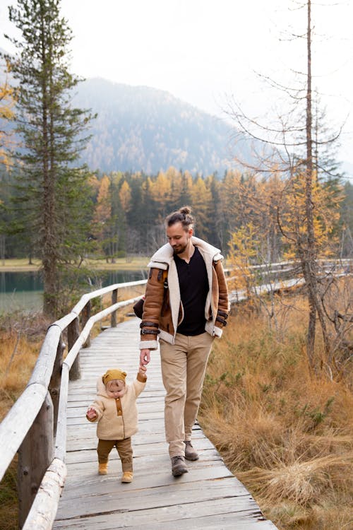 Free Photo Of Man Holding Baby's Hand Stock Photo