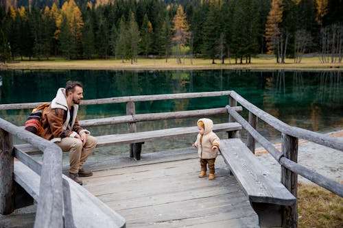 Free Photo Of Man Looking On Baby Stock Photo