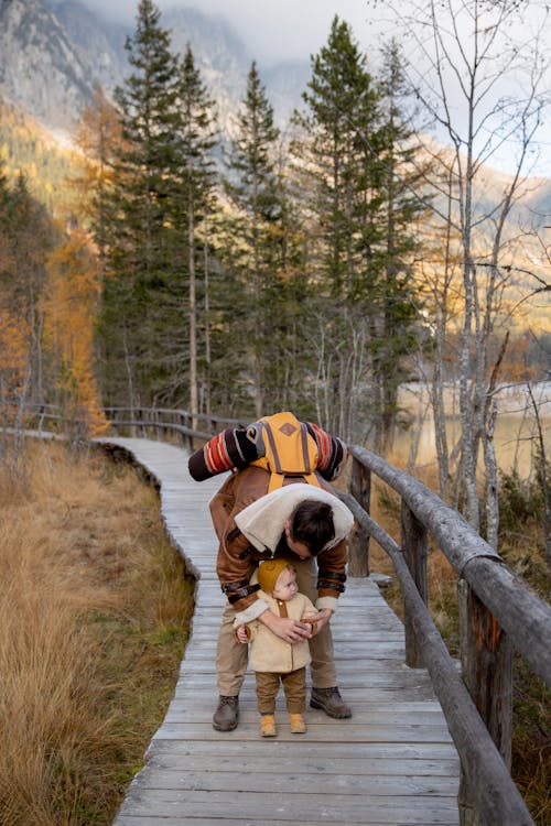 Photo Of Man Holding Baby