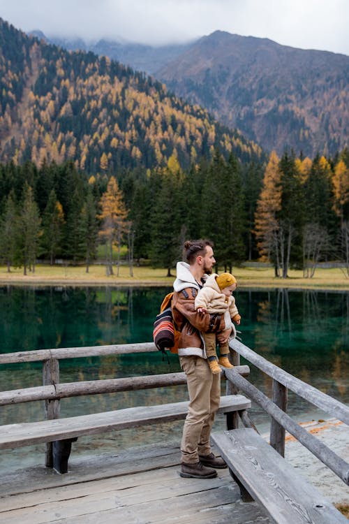 Free Photo Of Man Carrying Baby Stock Photo