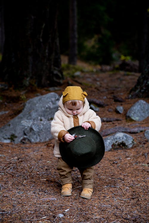 Free Photo Of Baby Holding Fedora Hat Stock Photo
