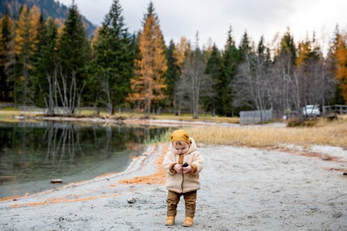 Free Photo Of Baby Near Lake Stock Photo