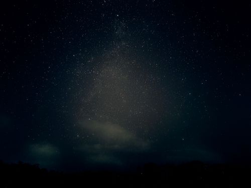 Free A breathtaking view of a starry night sky showcasing the Milky Way galaxy. Stock Photo