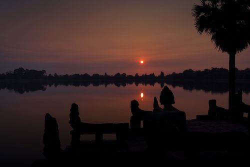 Free Peaceful sunrise reflecting on a lake, Siem Reap, Cambodia. Stock Photo