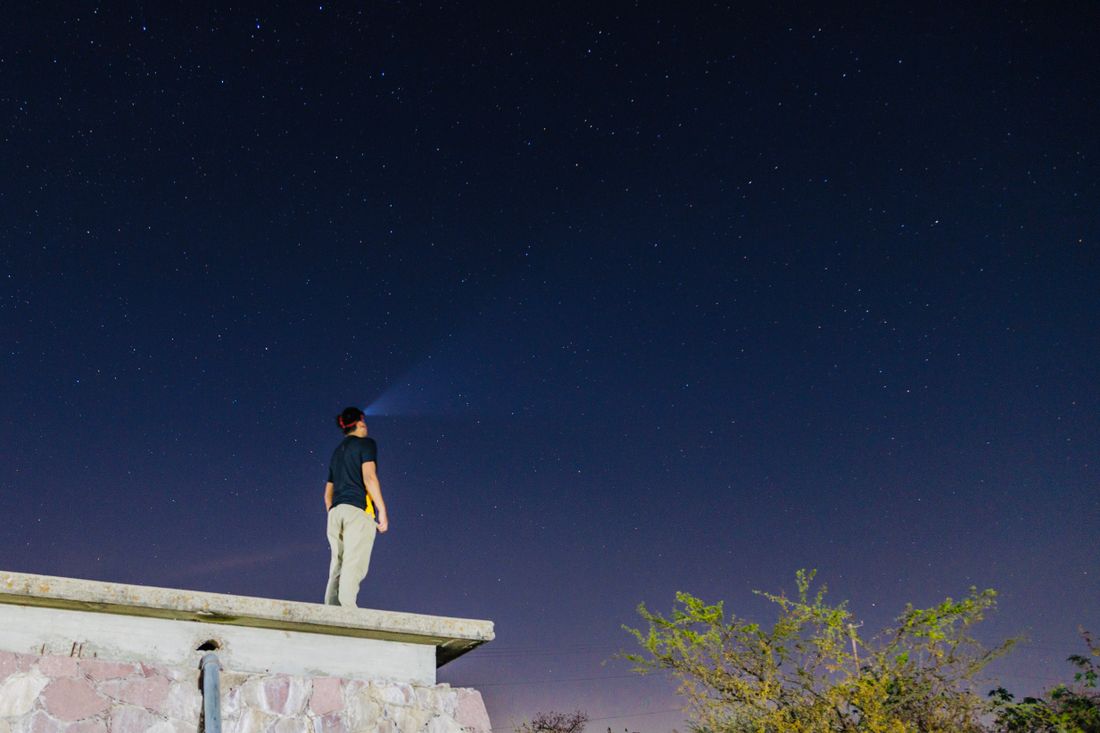 Edwin Marsh, founder of Emberwick, on a rooftop under the night sky