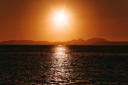 Free Scenic Photo Of Sea During Dawn Stock Photo