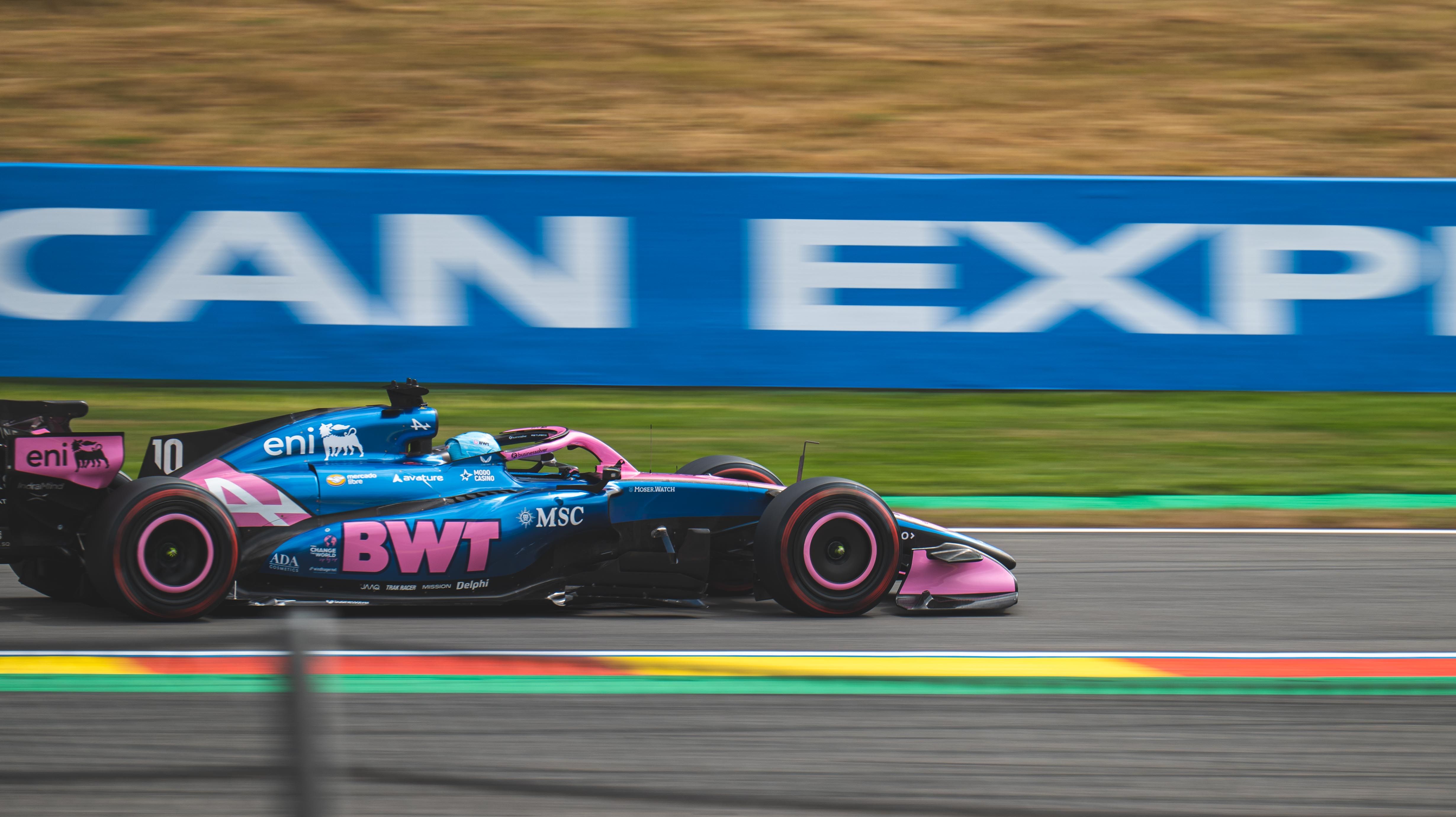 A high-speed Formula 1 car racing on the circuit of Spa-Francorchamps.