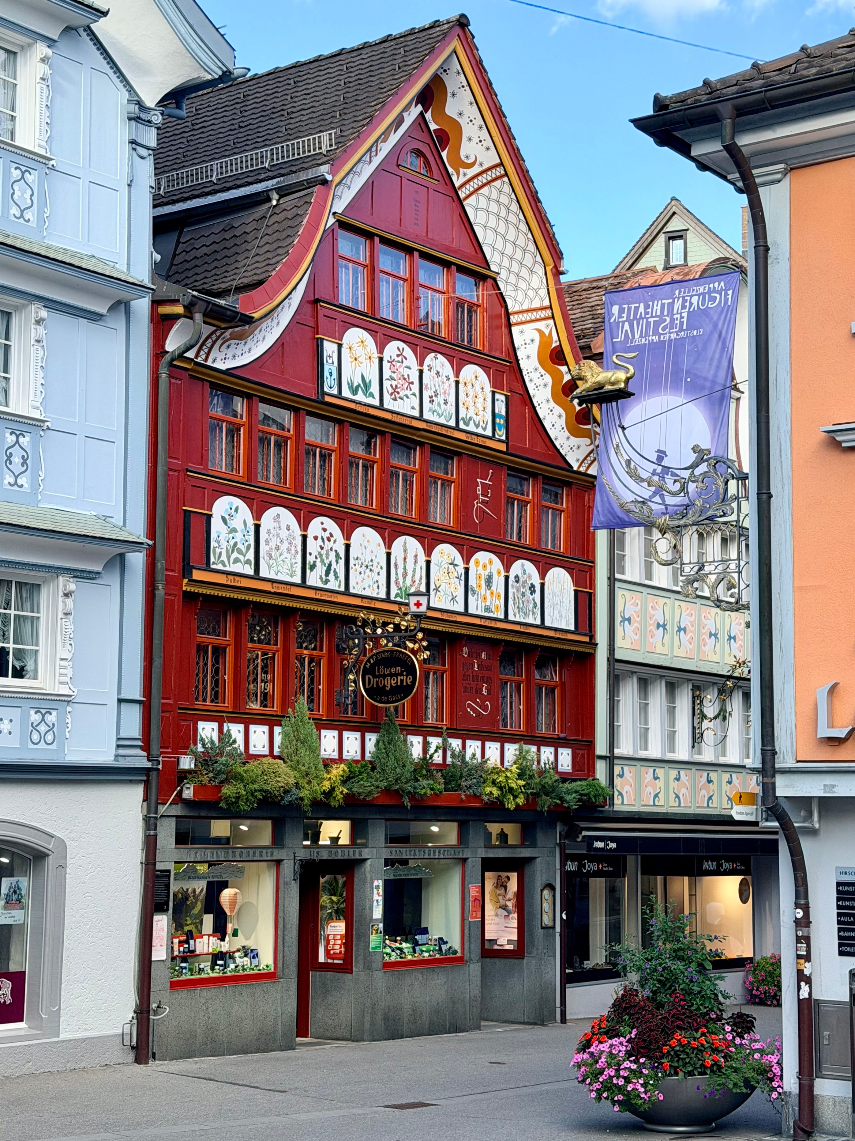 Charming traditional Swiss building in colorful Appenzell townscape, Switzerland, featuring classic architectural details.