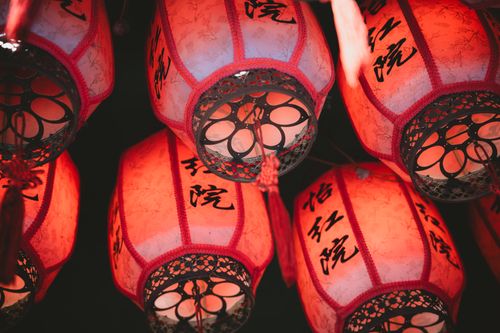 Free Colorful red Chinese lanterns decorate a festive street in Hong Kong, symbolizing celebration. Stock Photo