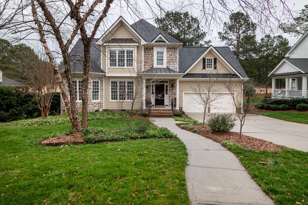 Living room with accent wall, neutral furniture, and minimal decor