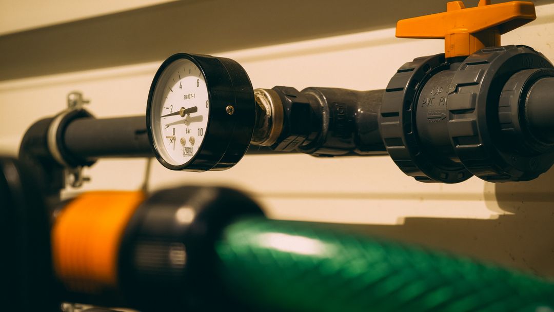 A pressure gauge fitted to a valved pipe assembly