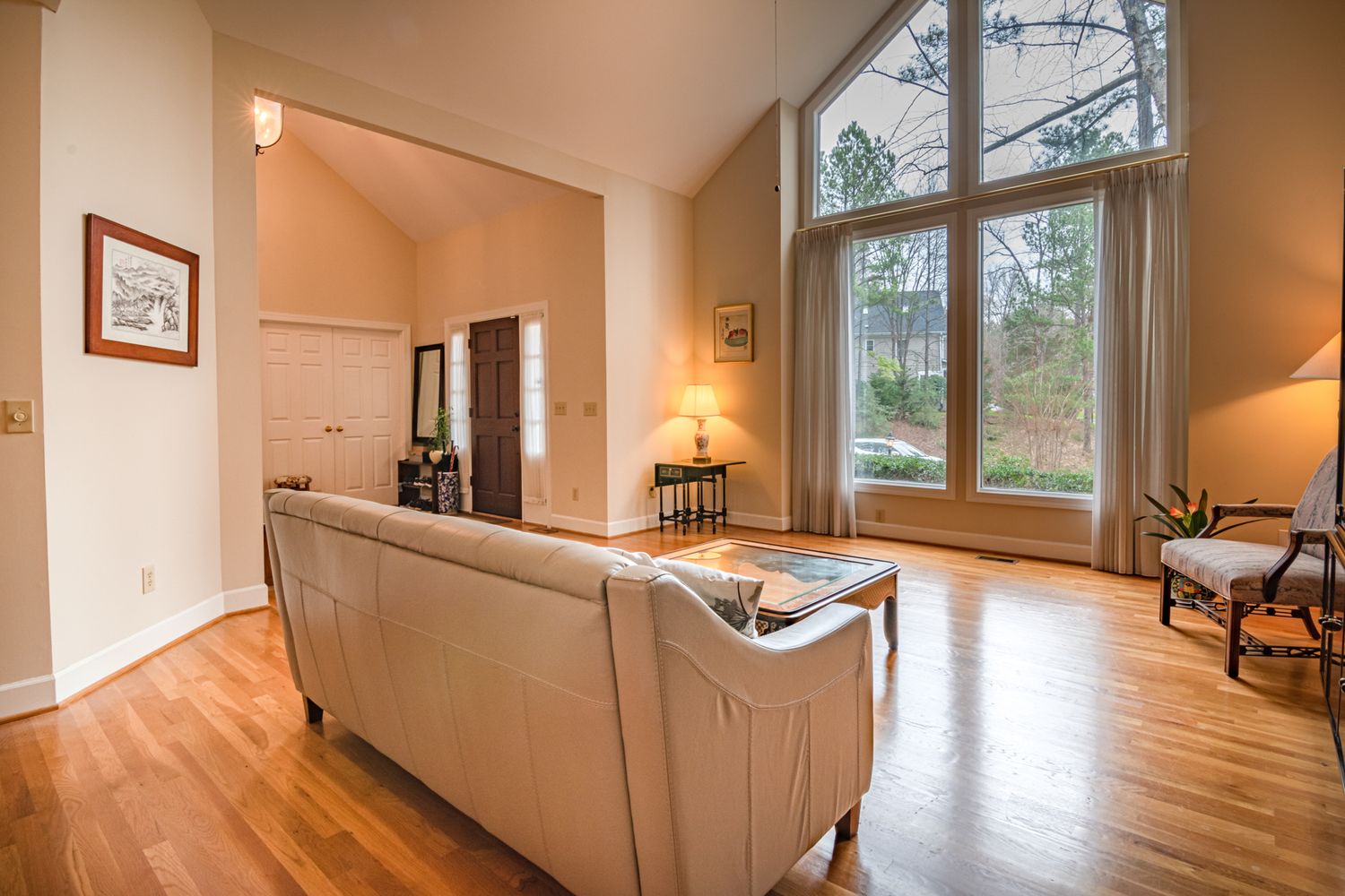 Bright fully renovated home interior with connected living spaces and finishes