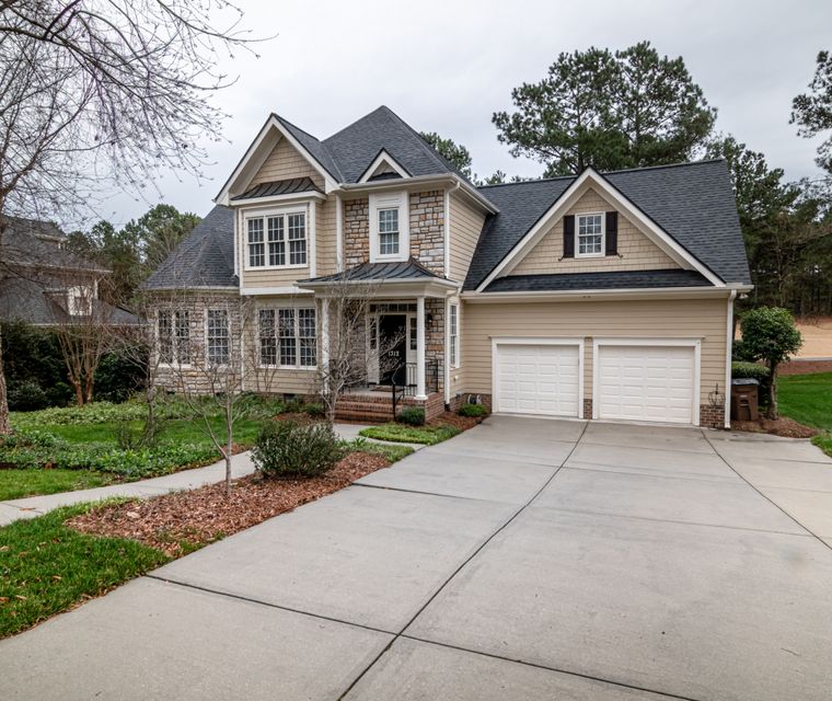 Paved driveway leading to a house