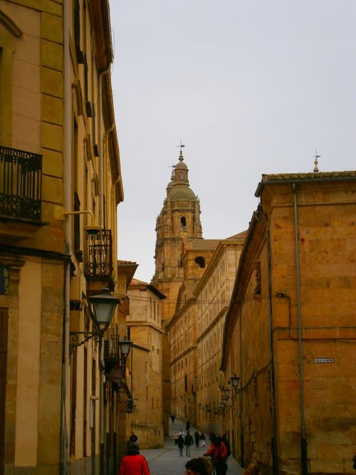 Free Charming European street scene with an ancient tower in Salamanca, Spain. Stock Photo