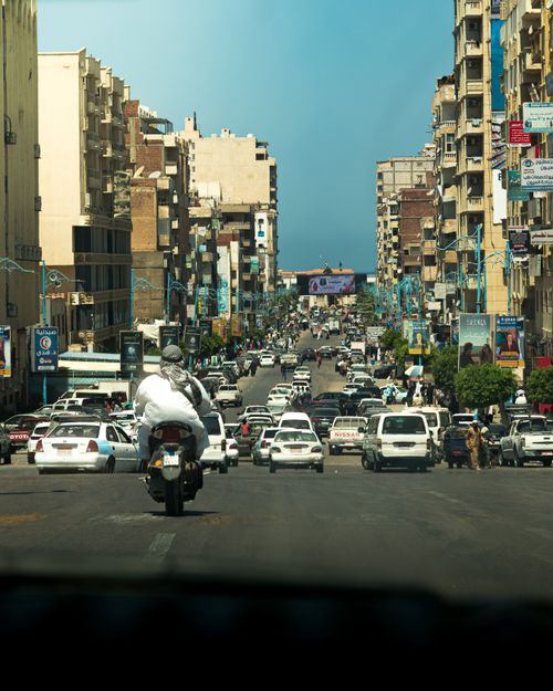Free Vibrant city life in Marsa Matruh with diverse traffic and architecture. Perfect for urban scenes. Stock Photo