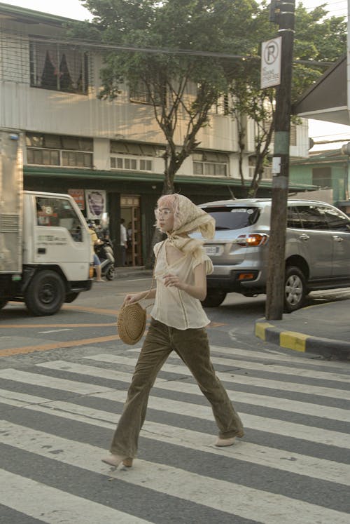 Free Woman Crossing the Street Stock Photo