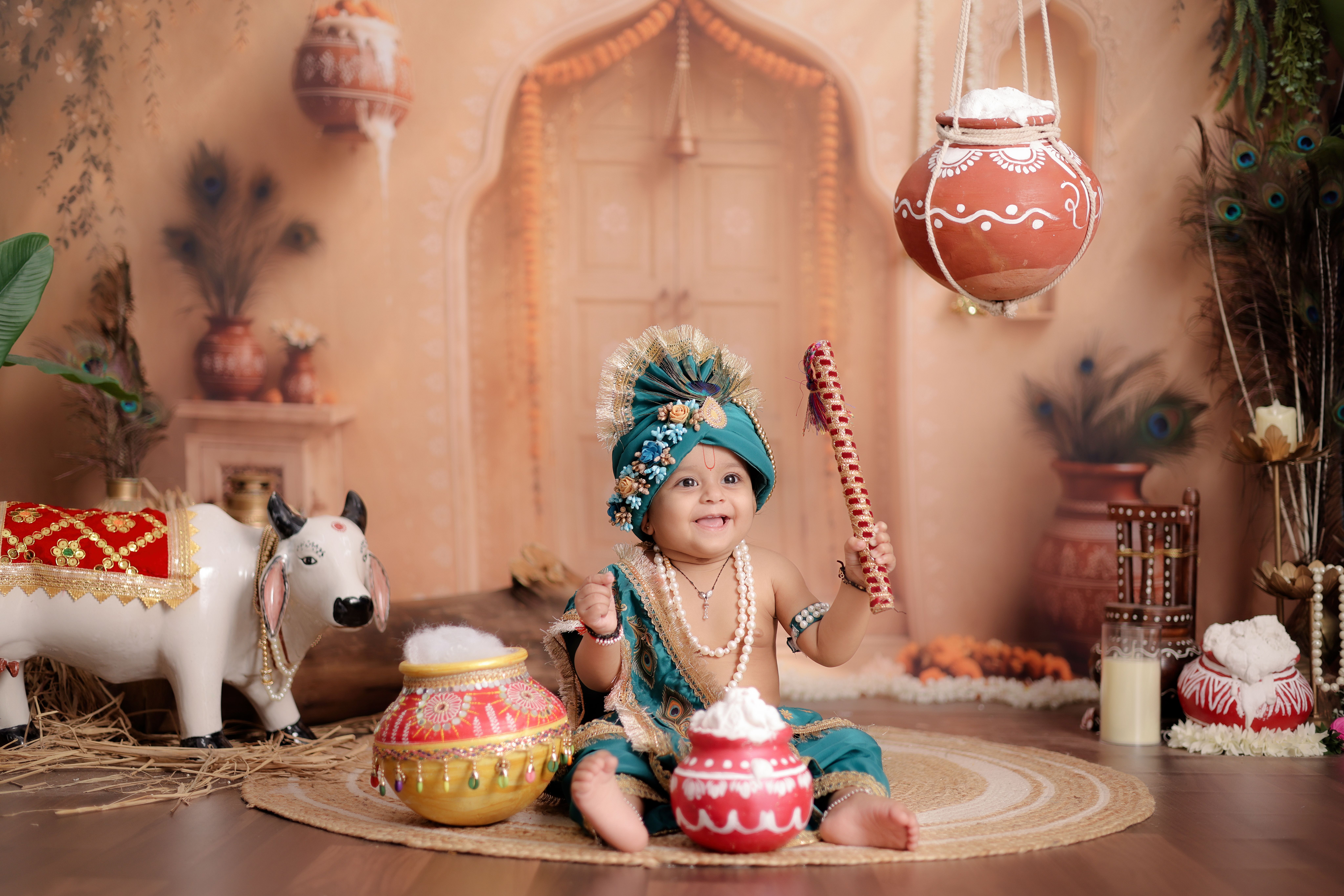 A baby dressed in traditional Indian attire with festive decorations, capturing cultural heritage.