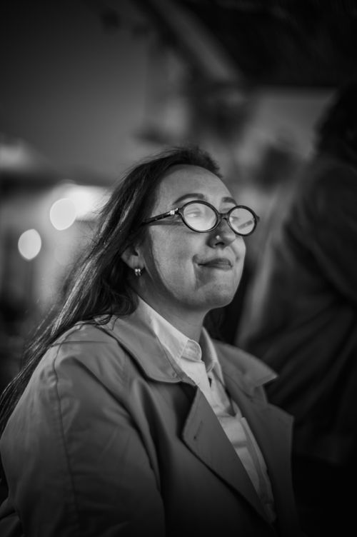 Free Black and white portrait of a woman wearing glasses, captured in a pensive moment. Stock Photo