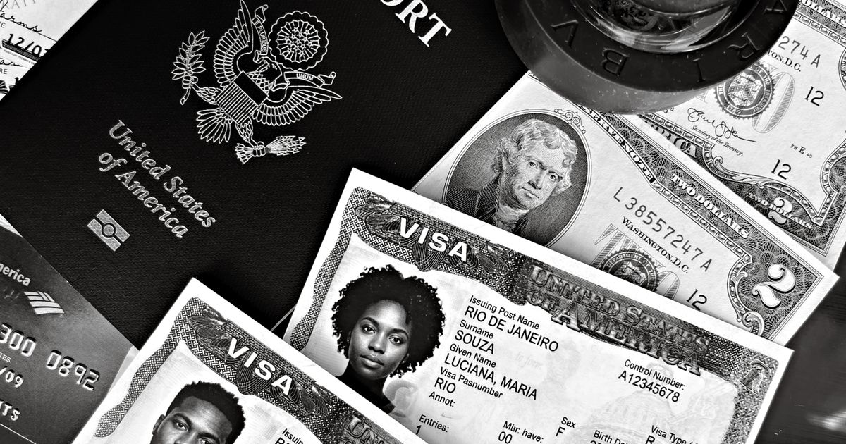 UK Skilled Worker Visa Requirements: Complete 2026 Guide — A black and white composition of a US passport, visas, and currency, showcasing travel essentials.